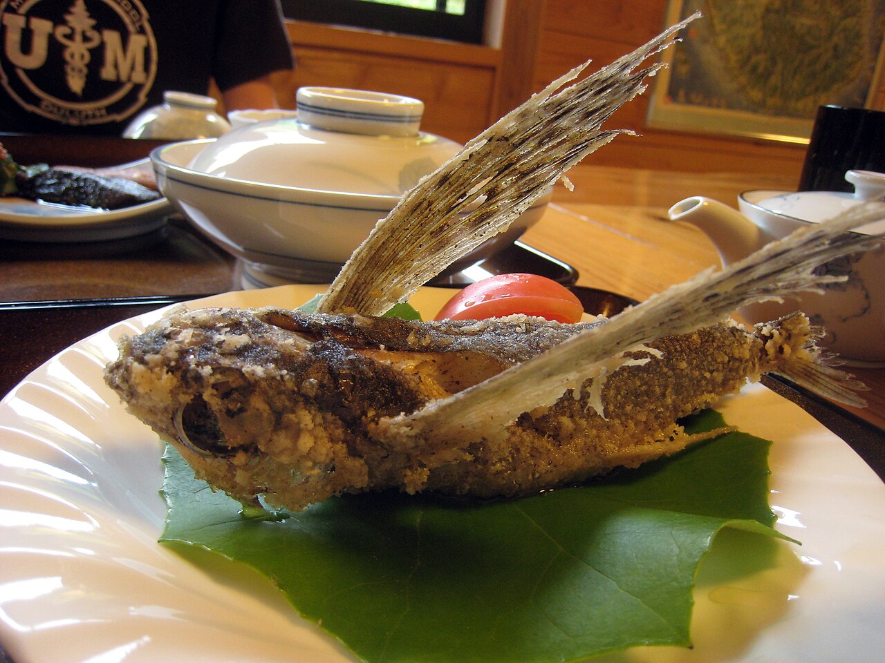 Real photograph of a whole fried flying fish