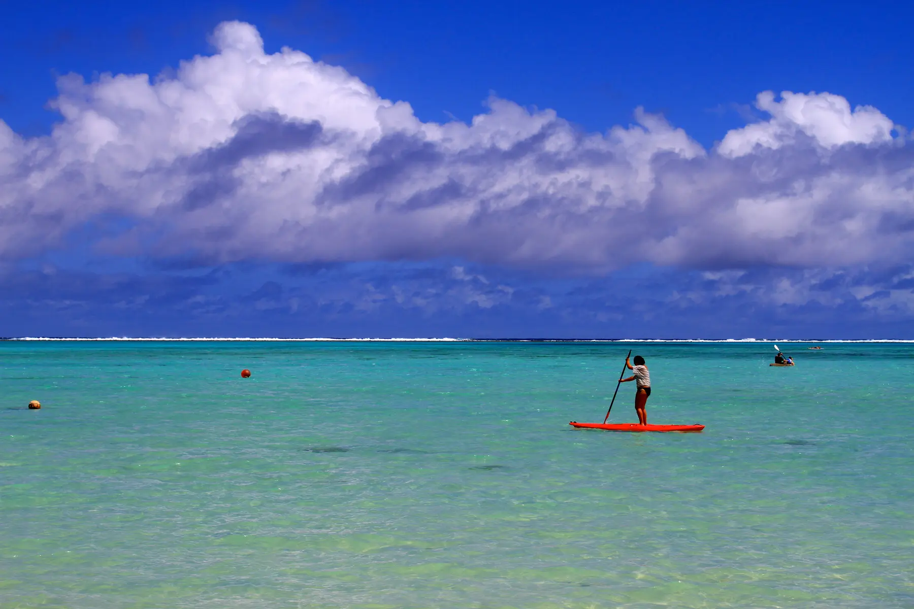 Paddleboarder on Muri Lagoon, Rarotonga